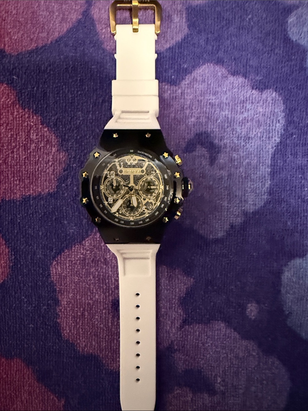 Invicta Black and White Skeleton Dial Watch with Gold Accents